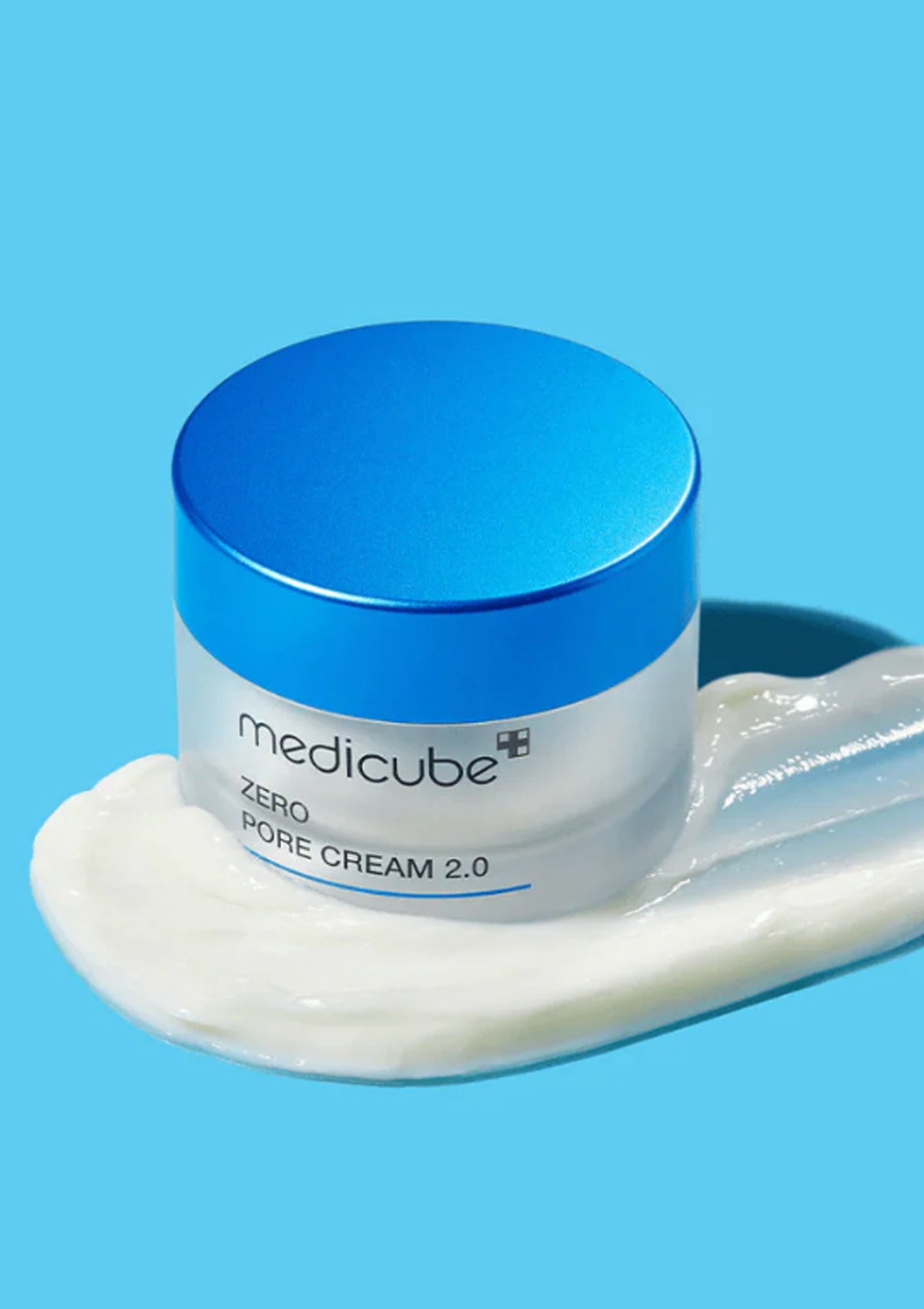 Jar of Medicube Zero Pore Cream 2.0 with a blue lid on a blue background